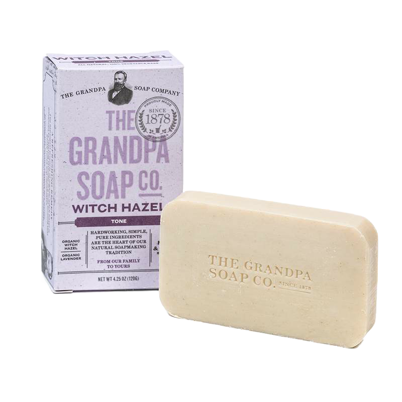 Handcrafted bar of mild witch hazel soap with organic lavender, embossed with a vintage logo, alongside a pastel lavender box, perfect for Health & Wellness and Grooming collections.