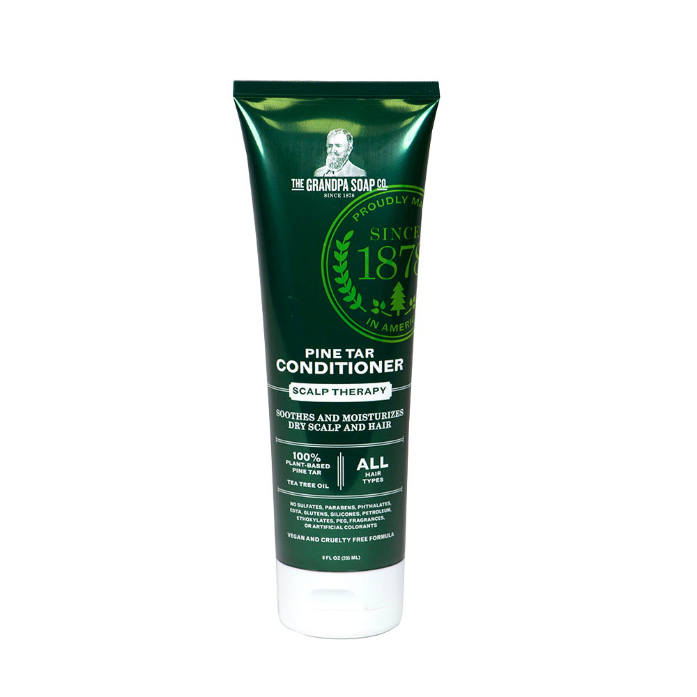 Dark green tube of handcrafted conditioner for scalp therapy, made in USA with plant-based pine tar and tea tree oil, featured in Health & Wellness and Best Sellers collections.
