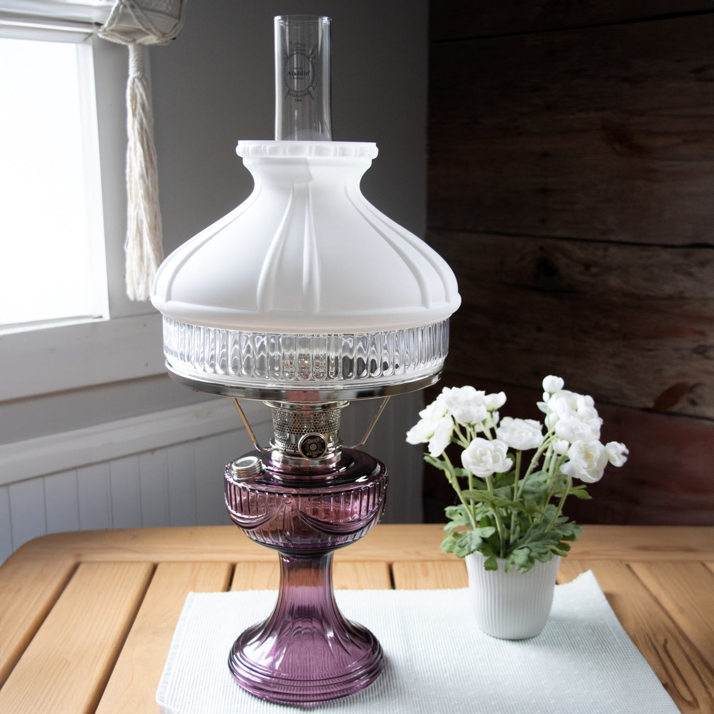 Handcrafted oil lamp featuring an amethyst glass base with a clear ribbed lower section, brass burner, and frosted white top shade, perfect for Farm, Garden & Tool, Lamps & Lighting, Emergency Supplies, Oil Lamps, Table Lamps, Best Sellers, and Promo Eligible collections. Bright enough for reading and made with Amish craftsmanship.