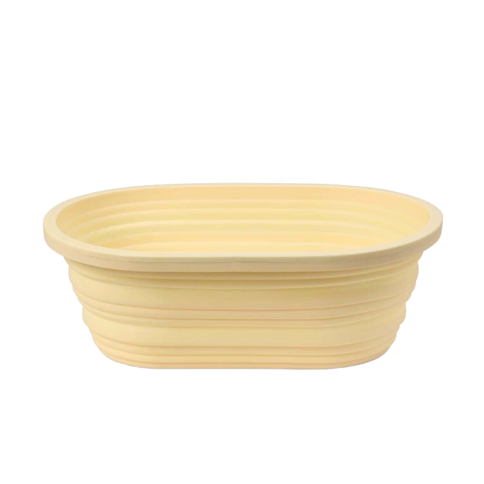 Light beige oval collapsible bread proofing basket made of durable silicone with steel rim, designed for easy dough rising and compact storage in Kitchen & Food and Baking Supplies collections.