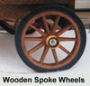 Close-up of a handcrafted wooden spoke wheel with a solid rubber tire, part of specialty kitchen and food equipment designed for making ice cream and featured in best-selling collections.
