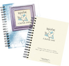 Two spiral-bound guided journals with one featuring a cracked blue cover and framed dove artwork, and the other a cream cover with inspirational text, part of heritage and lifestyle books collection.