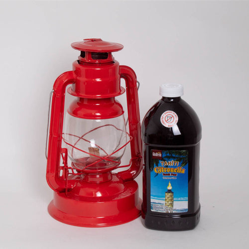 Bright red metal oil lantern with clear glass globe alongside a black plastic bottle of citronella oil for outdoor mosquito repellent, ideal for camping and garden use in Farm, Garden & Tool, Lamps & Lighting, Pest Control, and Best Sellers collections.