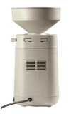 Beige electric stone grain mill with large hopper and vented motor housing, designed for effortless home flour milling, featured in Kitchen & Food, Grain Mills, and Best Sellers collections.
