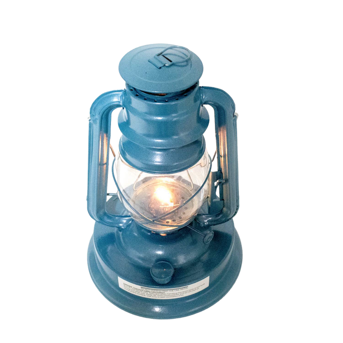 Handcrafted blue metal lantern with clear glass globe and steady burning flame, ideal for farm, garden, camping, emergency use, and outdoor lighting collections.