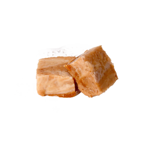 Two handcrafted creamy caramel-colored fudge pieces resting on a delicate white paper doily, featured in Kitchen & Food, Snacks and Sweets, USA Made, and Best Sellers collections.