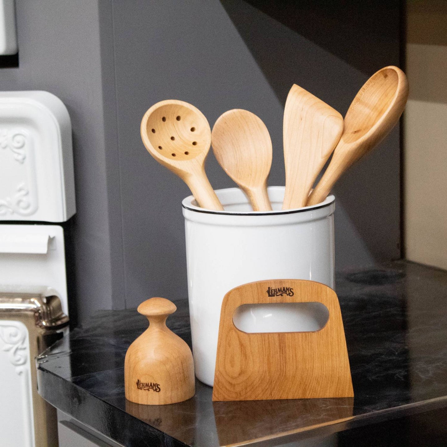 Handcrafted solid American Hard Maple wooden spoons, spatula, tamper, and scraper displayed in a white utensil holder on kitchen countertop, ideal for Kitchen & Food, Holiday Hosting, and USA Made collections.