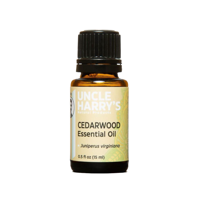 Amber glass bottle of pure cedarwood essential oil with black cap, handcrafted in USA for use in health remedies, aromatherapy, soapmaking, and candlemaking supplies.
