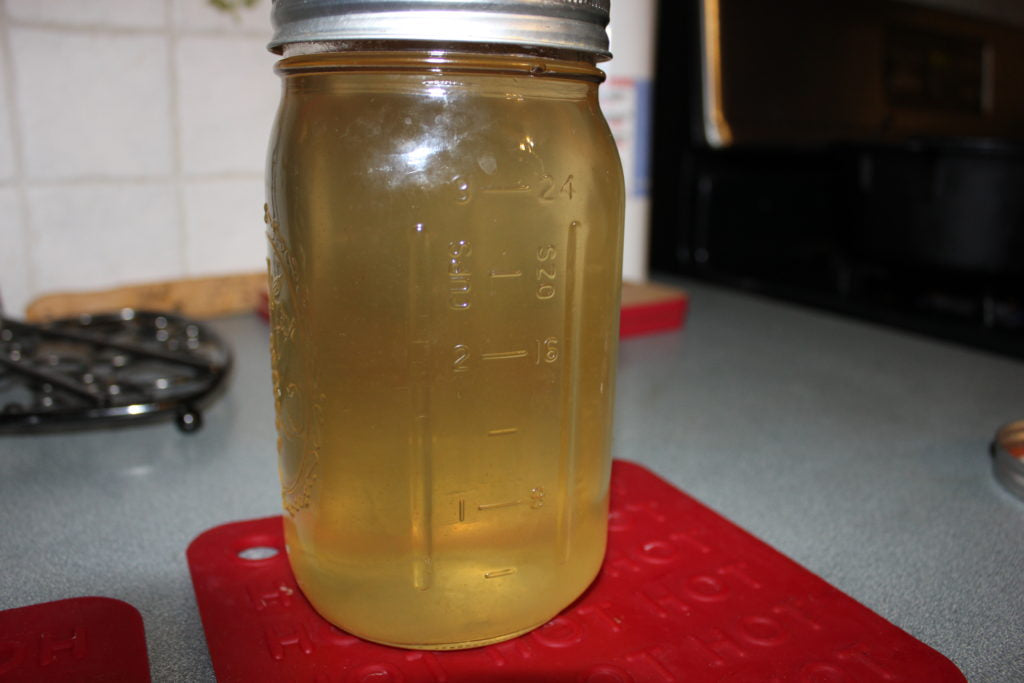 Jar of strained fat, ready to sit overnight.