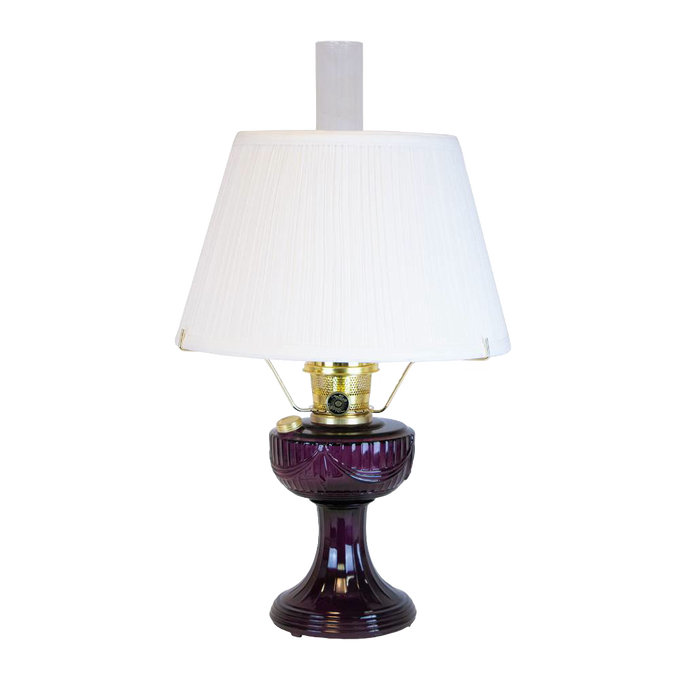 Handcrafted amethyst oil lamp with a distinctive Lincoln drape font design, brass fittings, and a 14-inch white pleated cloth shade, featured in Lamps & Lighting, Oil Lamps, and Best Sellers collections.