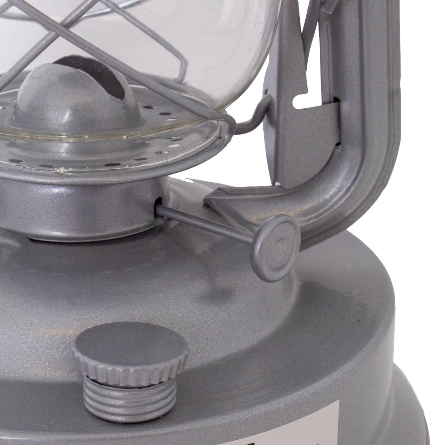 Close-up of a handcrafted metal lantern’s fuel valve and wick adjustment knob, designed for reliable bright lighting in farm, garden, camping, and emergency supplies collections.