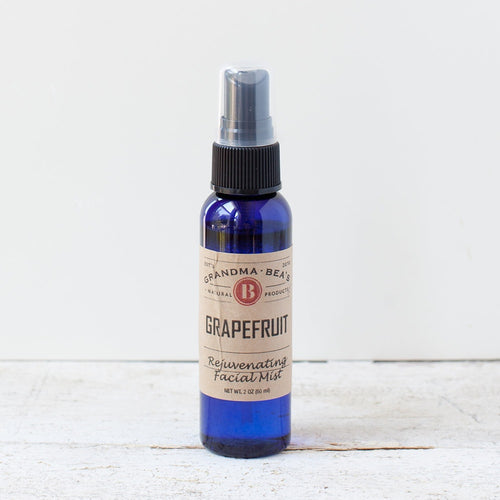 Blue glass spray bottle of handcrafted grapefruit facial mist with natural ingredients, featured in Health & Wellness, Grooming and Personal Hygiene, USA Made, Best Sellers, and Promo Eligible collections.