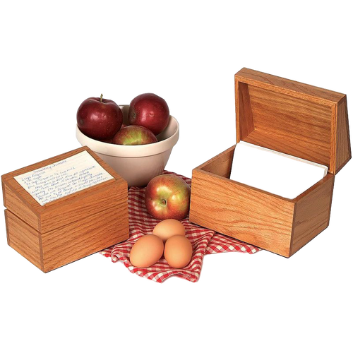 Handcrafted solid oak recipe box with smooth protective finish and recessed hinges, shown with handwritten recipe cards, fresh apples in a ceramic bowl, and eggs on a red checkered cloth, ideal for Kitchen & Food, Cookware, Baking Supplies, Holiday Hosting, Kitchen Gadgets, Kitchen Accessories, Storage and Serving, USA Made, Best Sellers, and Promo Eligible collections.