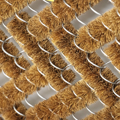 Close-up of a handcrafted bootscraper featuring densely packed natural coconut fiber bristles woven around sturdy wire frames, part of Home & Decor, Home Textiles, Best Sellers, and Promo Eligible collections.