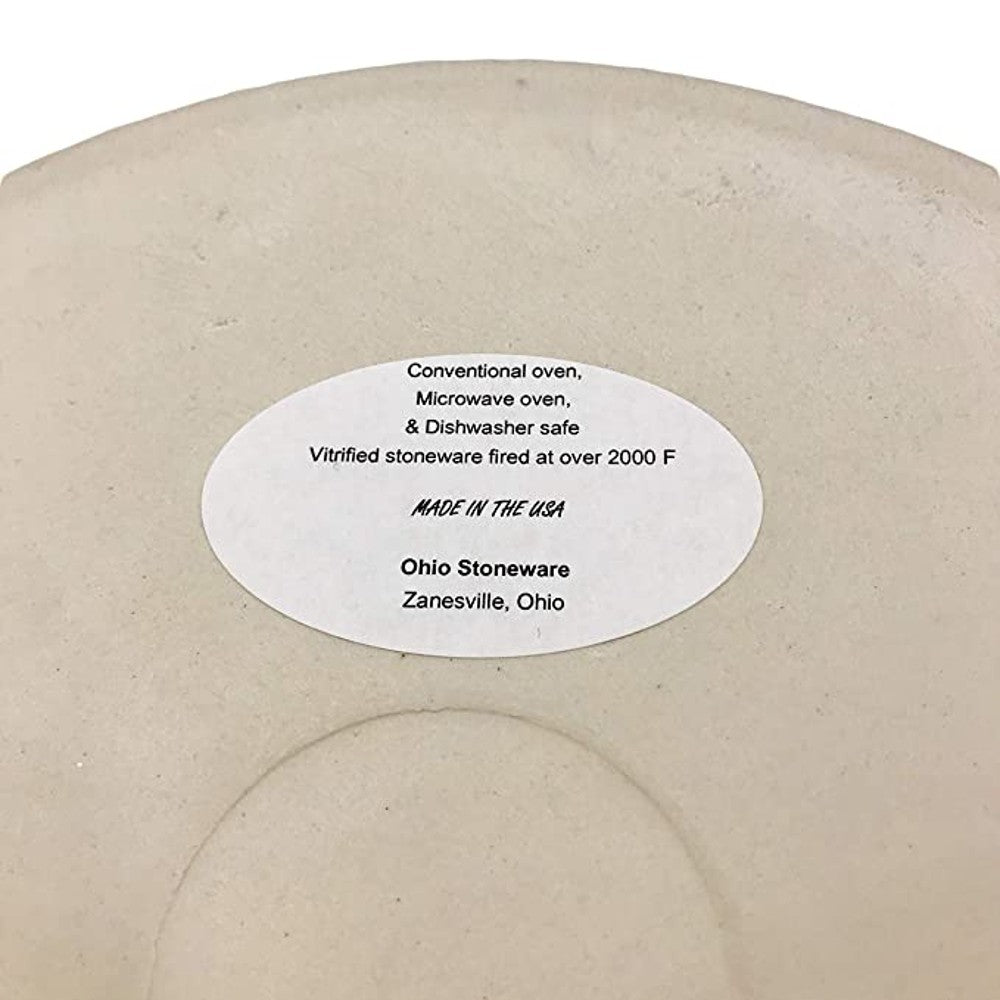 Bottom view of handcrafted stoneware crock with label indicating it is vitrified, dishwasher, microwave, and oven safe, made in USA, featured in Home & Decor and Kitchen & Food collections.