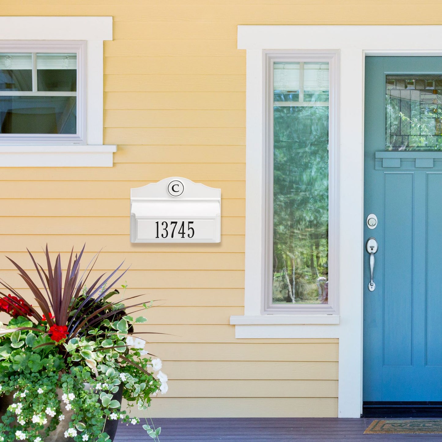 White and black handcrafted wall mount mailbox with personalized monogram and house number, enhancing curb appeal on a yellow home exterior in Home & Decor and USA Made collections.