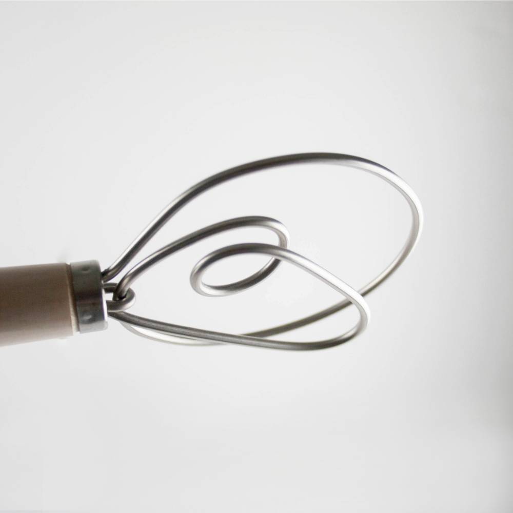 Close-up of a handcrafted Old Country Dough Whisk with a smooth wooden handle and two durable spiral metal wires, Amish made in the USA, featured in Kitchen & Food and Baking Supplies collections.
