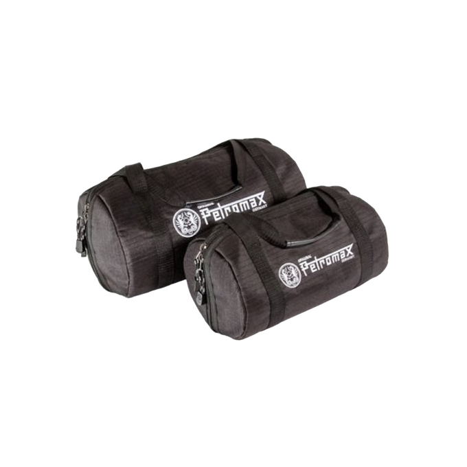 Set of two durable black transport bags made from ripstop fabric, designed for safely carrying fire kettles and other cookware, featured in Kitchen & Food and Cast Iron collections.