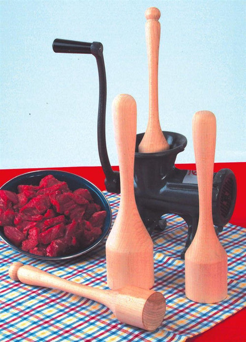 Set of smoothly sanded hardwood wooden stompers beside a vintage-style black metal meat grinder and a bowl of fresh red meat, part of Kitchen & Food, Specialty Equipment, and Amish Made collections.