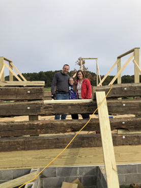 Installing the logs of the hand hew cabin