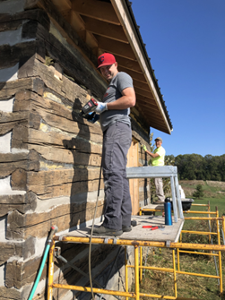 The chinking of the log cabin