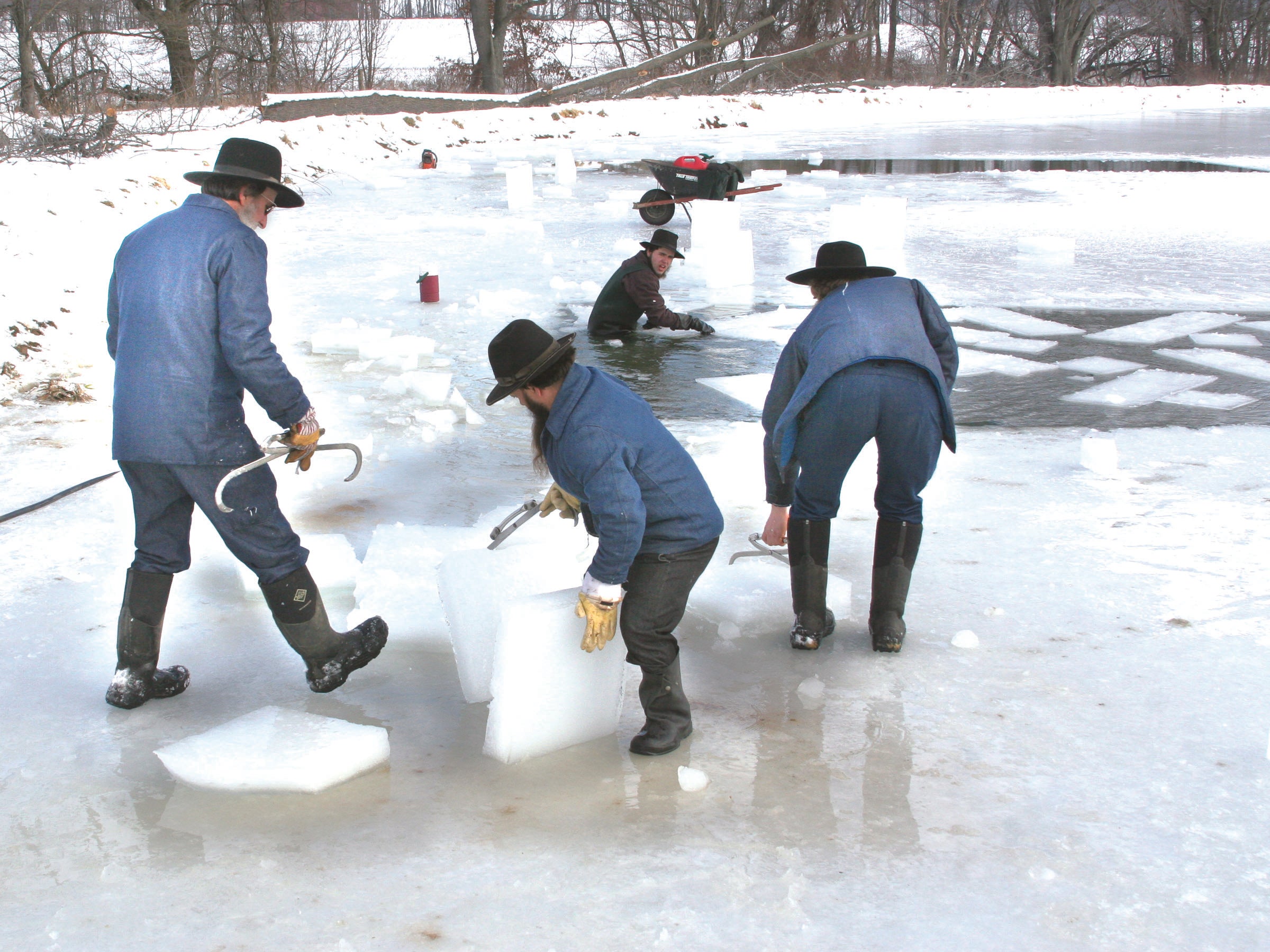 Men pulling ice
