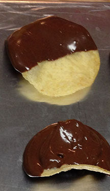 Cooled and set, chocolate-dipped Gold N' Krisp chips are ready for a close-up!