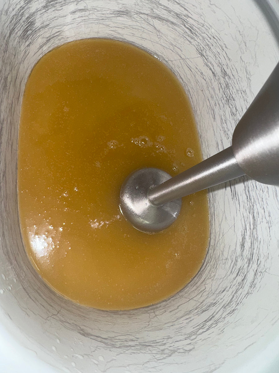 Mixing soap with immersion blender