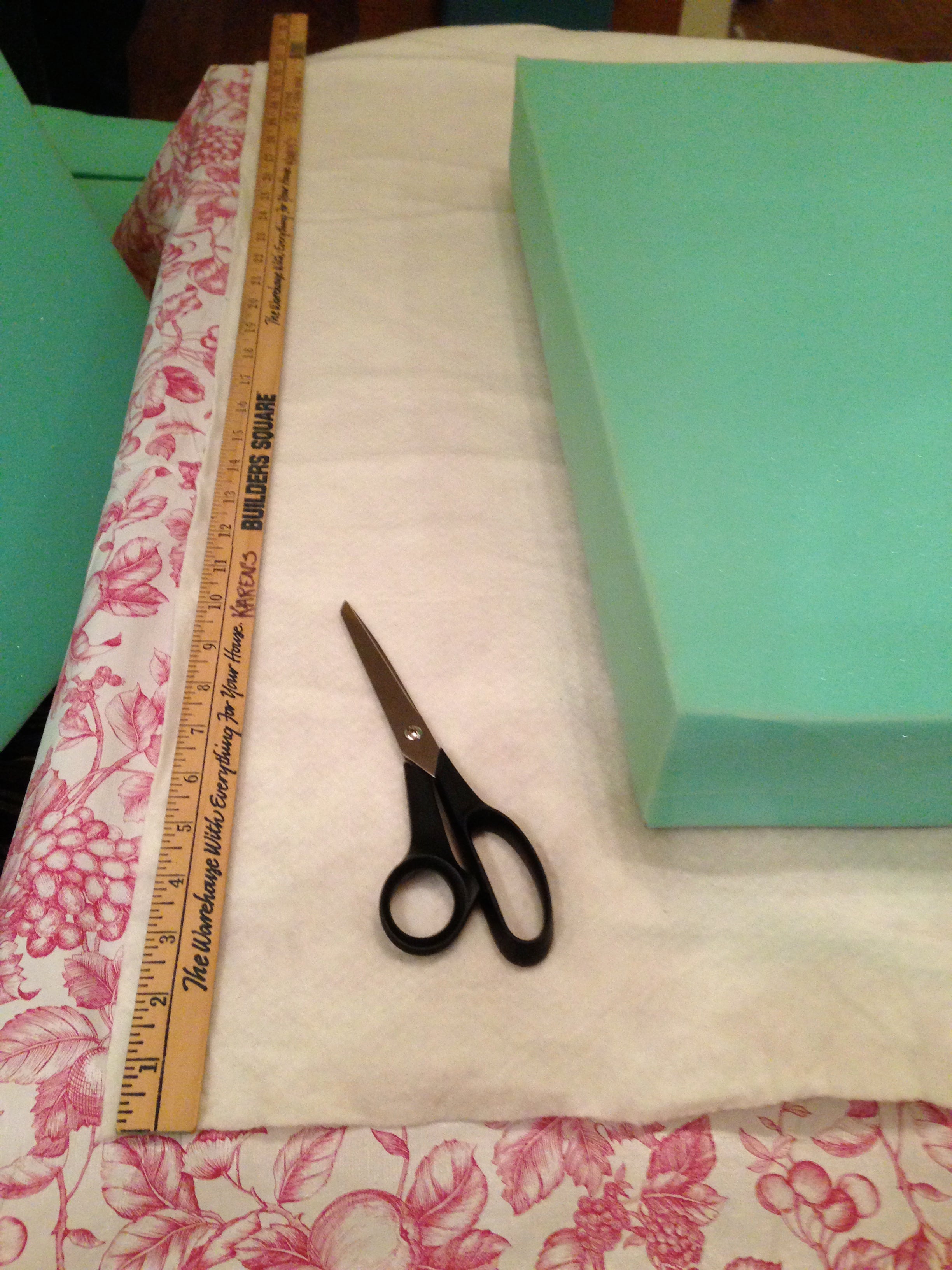 The batting is 50 inches wide, and wraps around the foam like paper around a package.