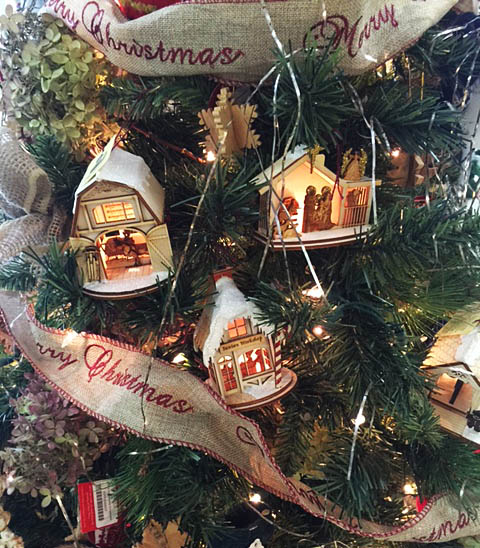 cottage ornaments on tree at store
